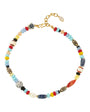 A colorful beaded necklace with a gold-tone clasp, featuring a variety of small beads in red, light blue, yellow, white, black, and patterned designs, displayed on a clean white background.