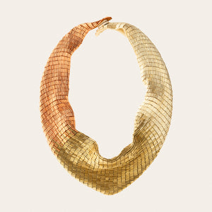 Rose Gold, Gold, and Bronze Beaded Scarf Necklace on Tan Background