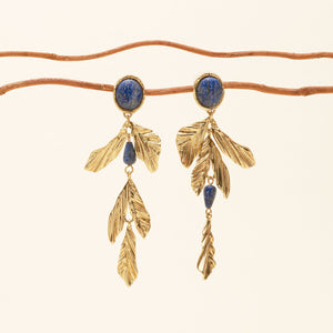 Stone and Gold Drop Earrings Staged On Branch with Cream Background