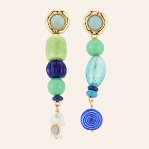 Blue and Green Beaded Earrings on Tan Background