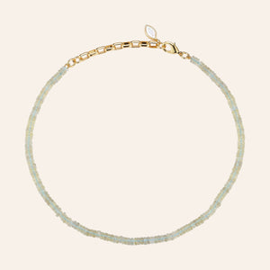 Lemon Yellow Beaded Strand Necklace on Tan Background