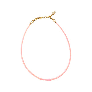 Pink Beaded Strand Necklace on Flat White Background