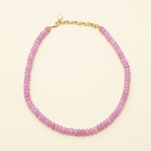 Purple Beaded Strand Necklace on Cream Background