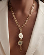 Gold Pendant Charm Necklace Styled on Model in Ivory Blazer