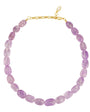 A beaded necklace made of oval-cut light purple amethyst beads, completed with a gold-tone lobster clasp and extender chain, shown on a plain white background.