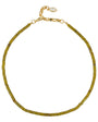 A delicate beaded necklace with olive green cylindrical beads and a gold-tone clasp, displayed on a clean white background.