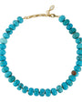A beaded necklace made of turquoise-blue round beads with a gold-tone chain clasp, shown on a plain white background.