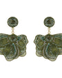 Green embroidered and beaded statement earrings against a white background