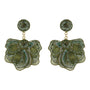 Green embroidered and beaded statement earrings against a white background