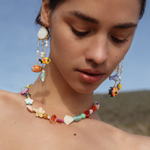 Shell, Pearl, and Multi Colored Fish Charm Drop Earrings Styled on Model
