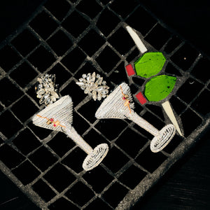 Silver Beaded Martini Drop Earrings Staged on Tile with Olive Martini Garnish