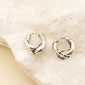 Twisted Silver Hoops Staged on Stone