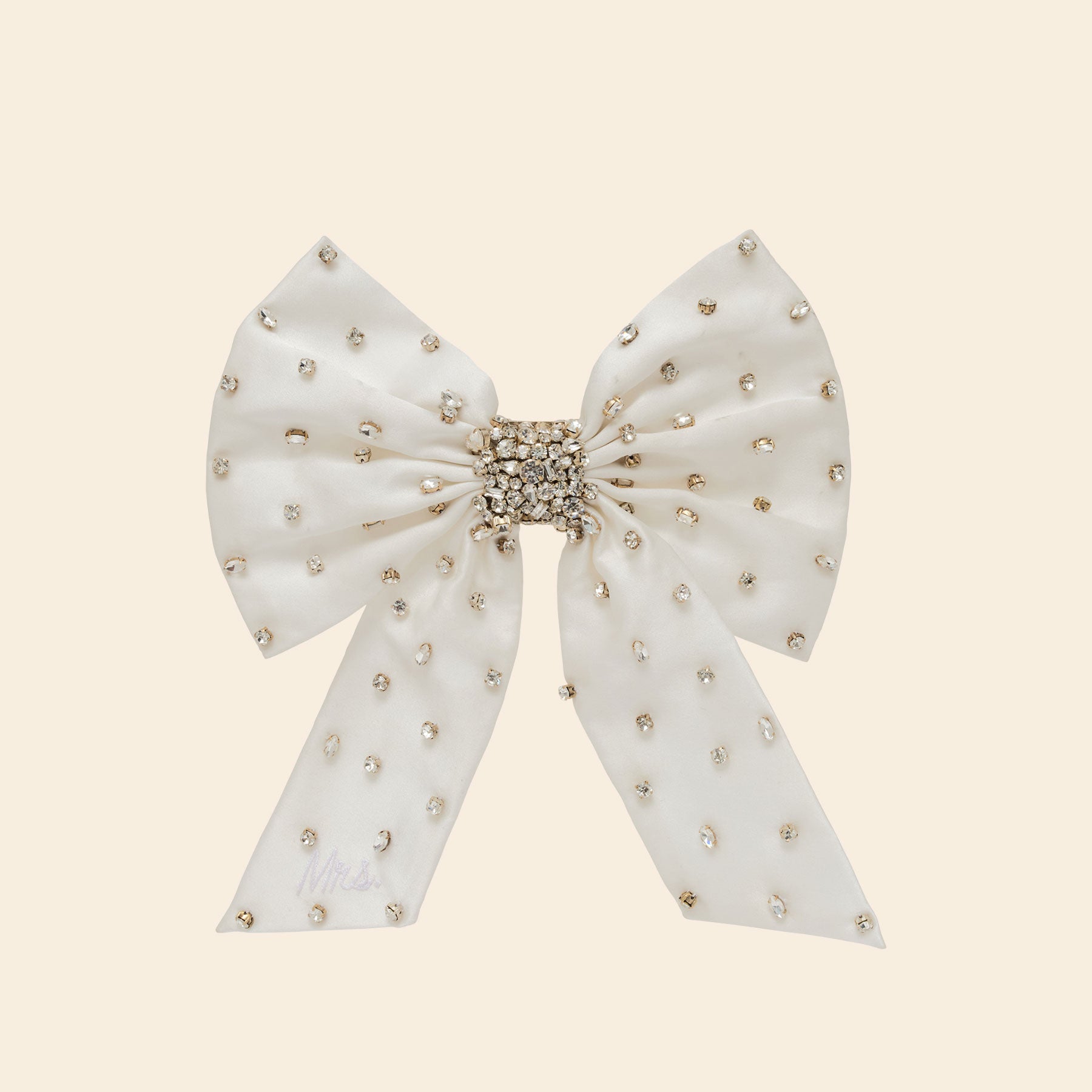 Silver and Crystal Embroidered Hair Bow on Tan Background
