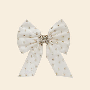 Silver and Crystal Embroidered Hair Bow on Tan Background