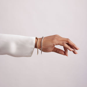 Silver and Gold Cuff Bracelet Set on Model's Hand