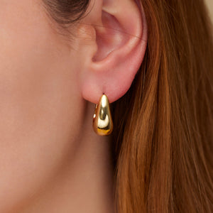 Small Gold Hoops on Model's Ear