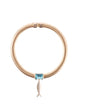 Necklace with a blue gemstone on a white background