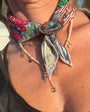 Model wearing a bandana necklace with a scarf ring around the front