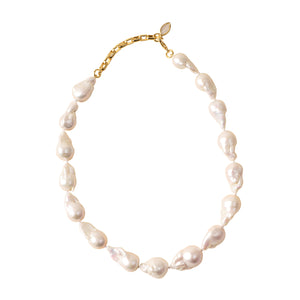 White Pearl Strand Necklace on Flat White Background