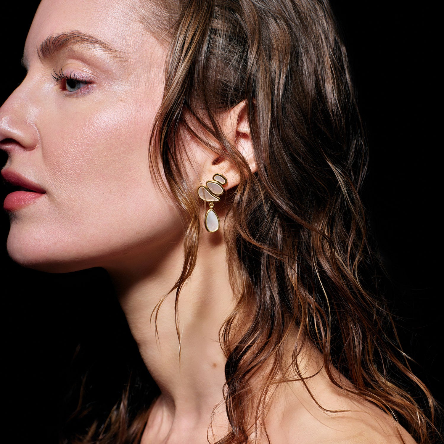 White Mother of Pearl and Gold Drop Earrings Styled on Model