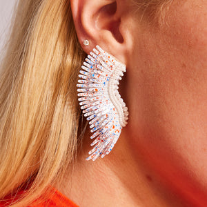 White Sequin and Bead Wing Stud Earrings with Red and Blue Splatter Paint on Model's Ear