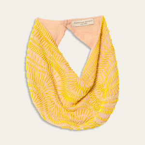 Beaded Yellow and Tan Based Scarf Necklace on Off-White Background