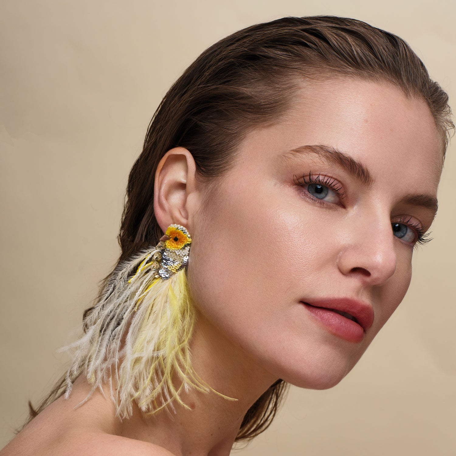 Yellow and Silver Embroidered Feather Bird Earrings on Model