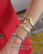 Maggie wearing the gold Swan Cuff