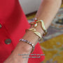 Maggie wearing the gold Swan Cuff
