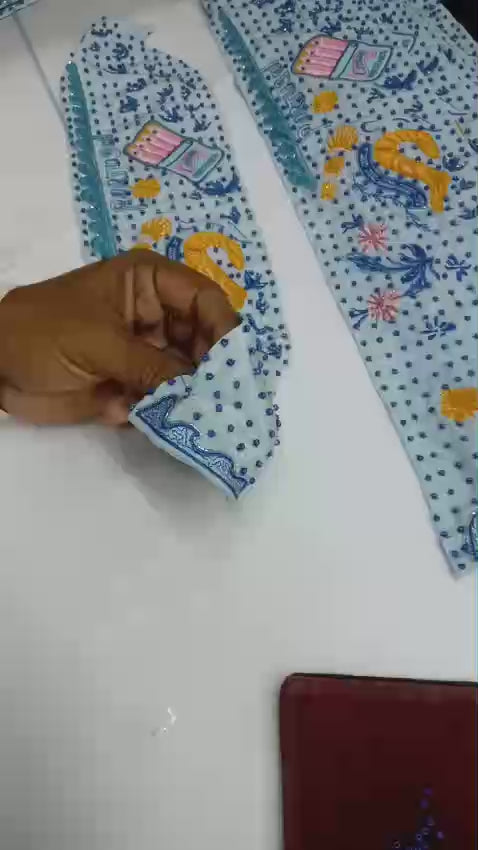 Woman hand beading a scarf necklace