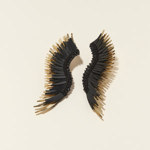 Black and Gold Sequin Wing Earrings on Cream Background