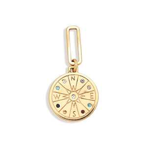 Gold Compass Charm with Multi-Colored Crystals on Flat White Background