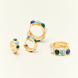 Pearl, Green, and Blue Stone Gold Hoop Earrings on Cream Background